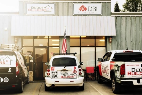 Debuty Builders office with company vehicles parked outside in Knoxville, TN