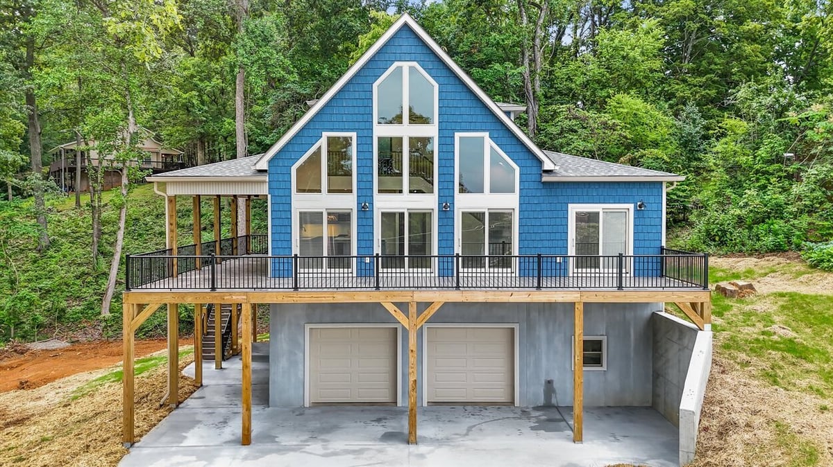 Front elevation of modern blue home with large windows in Friendsville Custom Home in Knoxville, TN