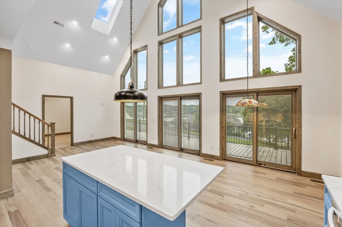 Interior view of living space with floor-to-ceiling windows in Friendsville Custom Home in Knoxville, TN