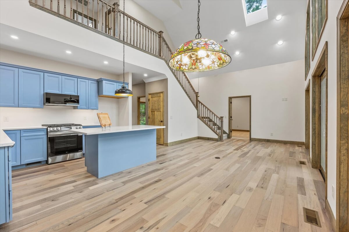 Open kitchen and living space with vaulted ceilings in Friendsville Custom Home in Knoxville, TN