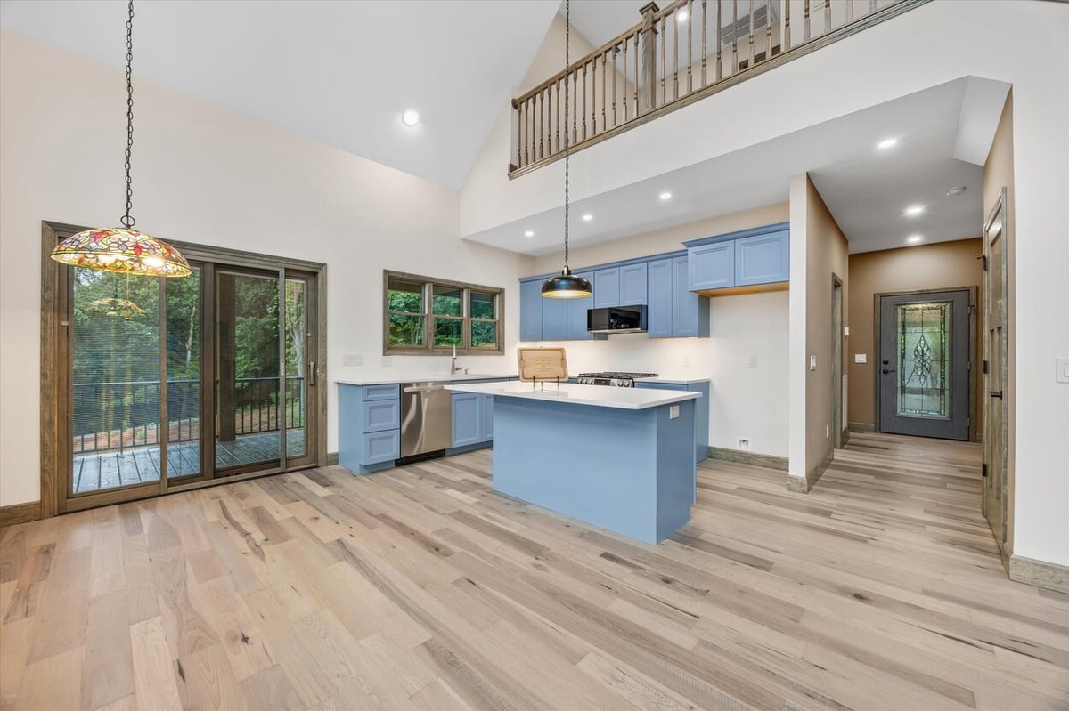 Open-concept kitchen and entryway with vaulted ceiling in Friendsville Custom Home in Knoxville, TN