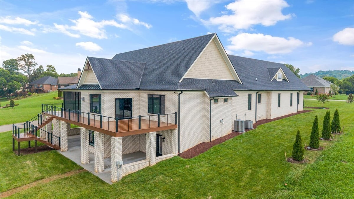 Angled exterior view showing deck and side yard of Louisville, TN Custom Home