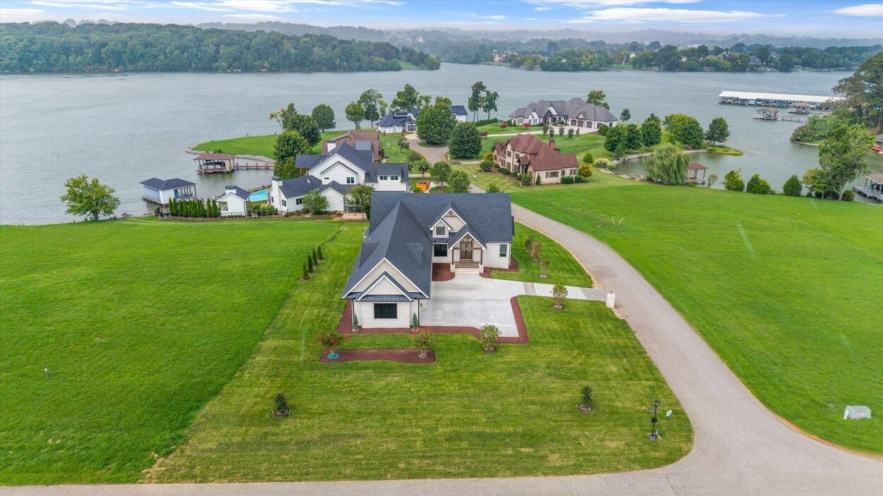 Front-facing aerial view of Louisville, TN Custom Home with driveway and manicured lawn