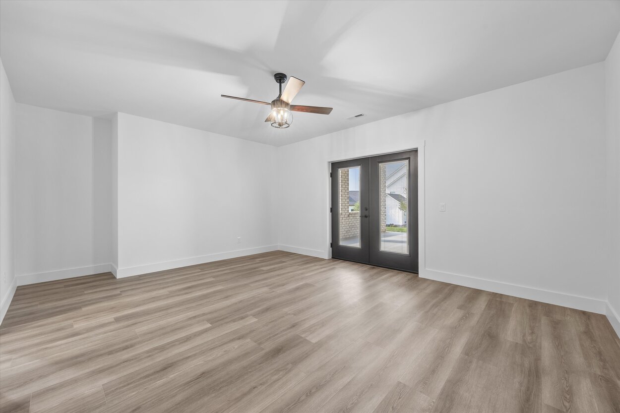 Louisville, TN custom home basement space with wide-plank flooring and neutral interior palette