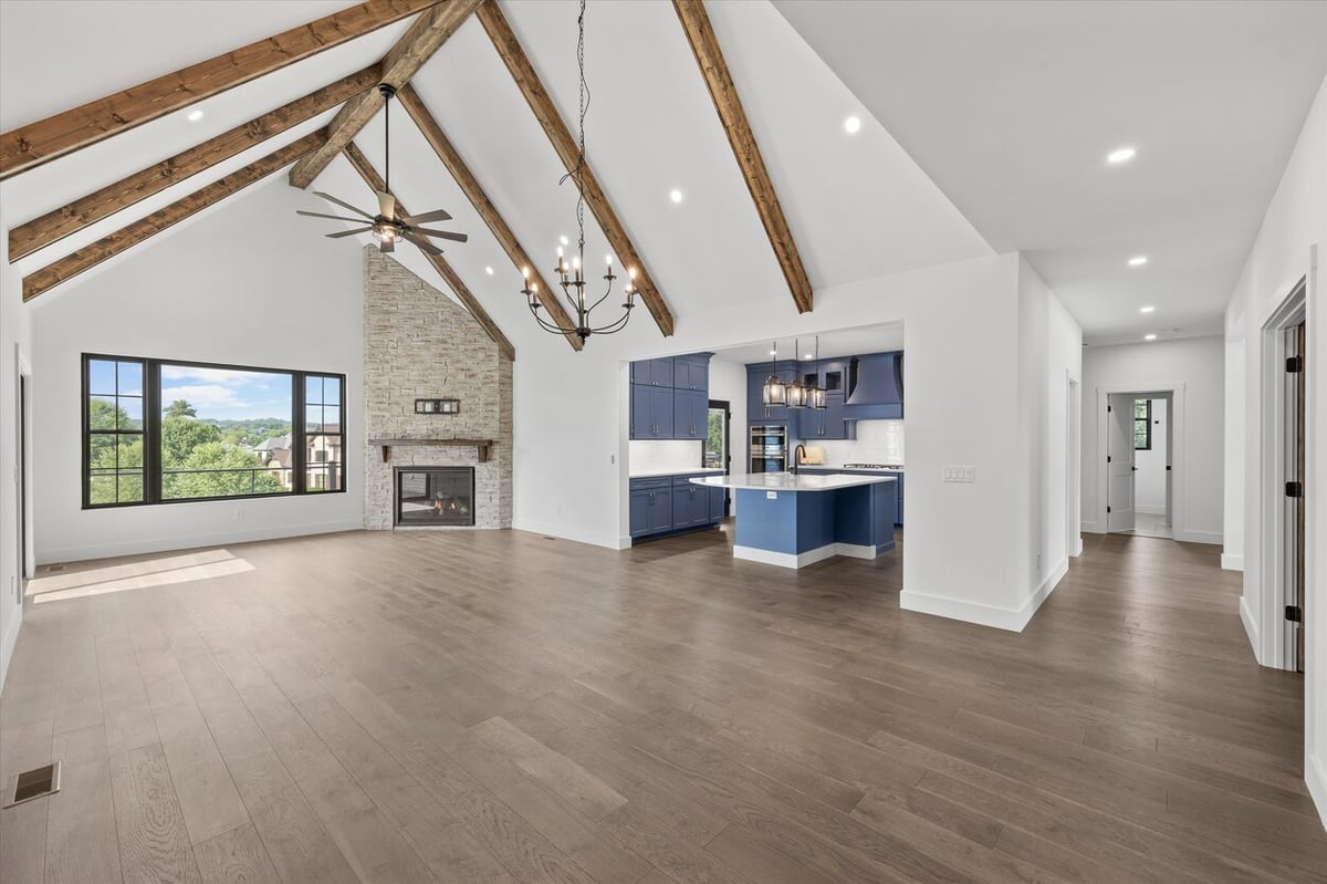 Spacious open floor plan in a Louisville, TN custom home connecting kitchen, living, and hallway areas
