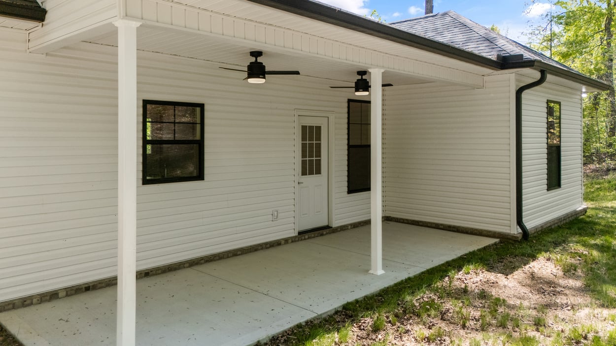 Covered back porch with ceiling fans on Vonore custom home in Knoxville, TN