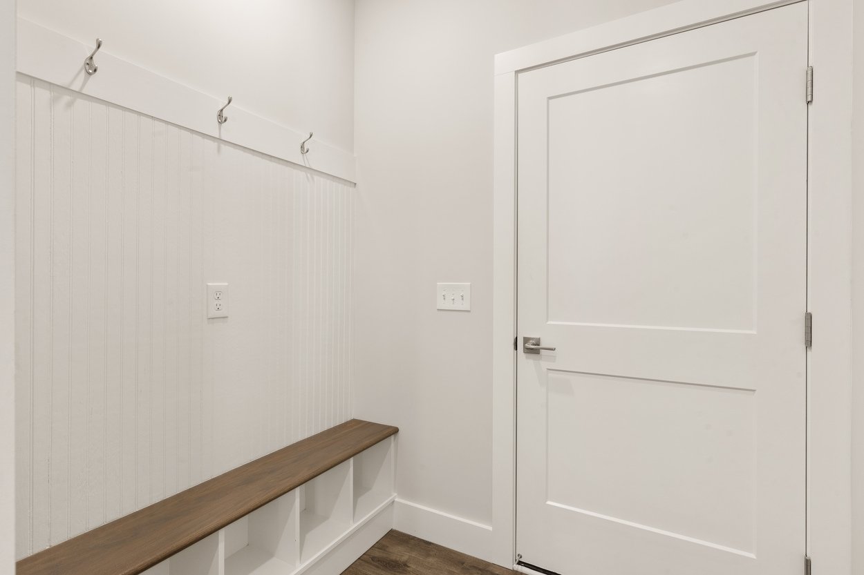 Bright primary bedroom with large windows in Vonore custom home in Knoxville, TN